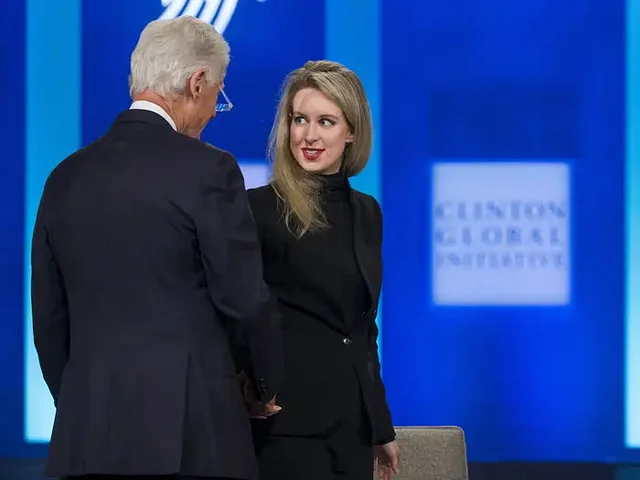 Elizabeth Holmes and Bill Clinton