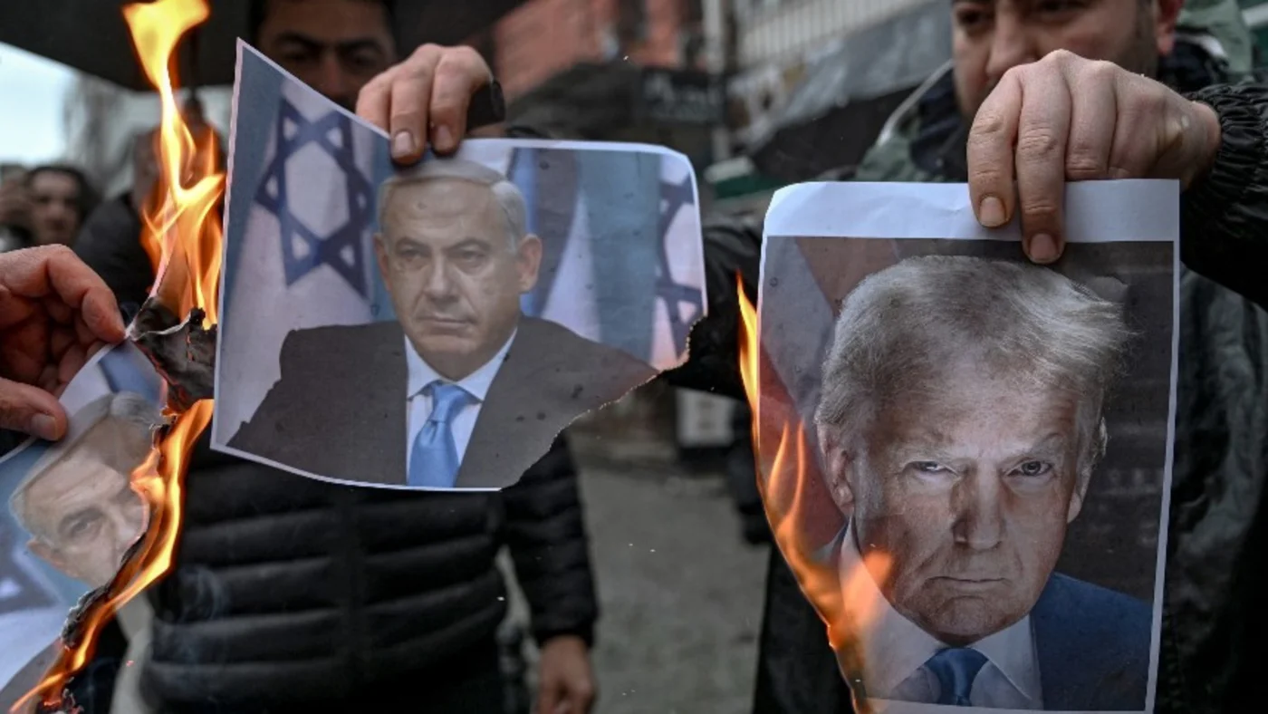Protesters burn portraits of Netanyahu and Trump
